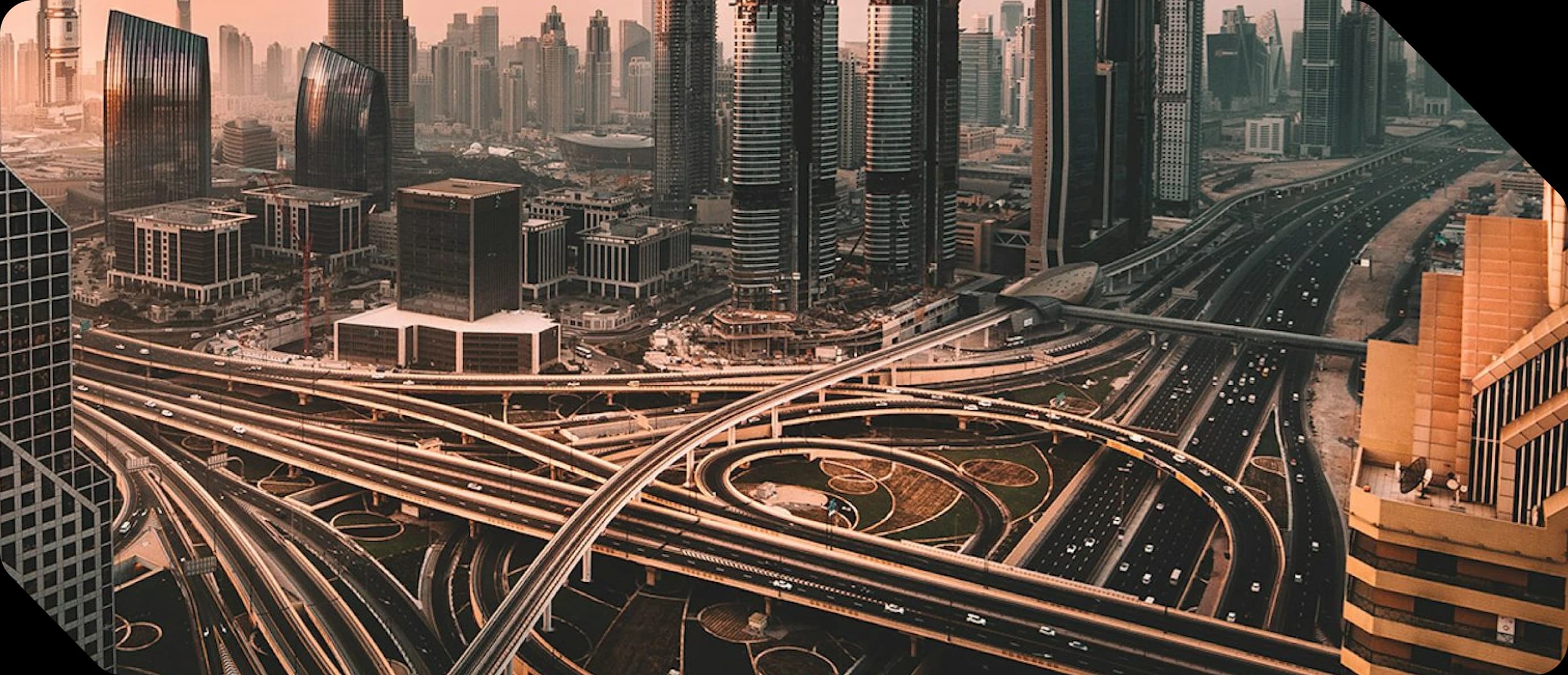 Aerial view of Downtown Dubai's Sheikh Zayed Road interchange at sunset